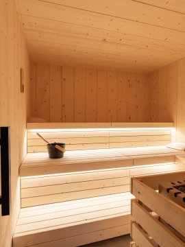Cozy wooden sauna with infusion bucket